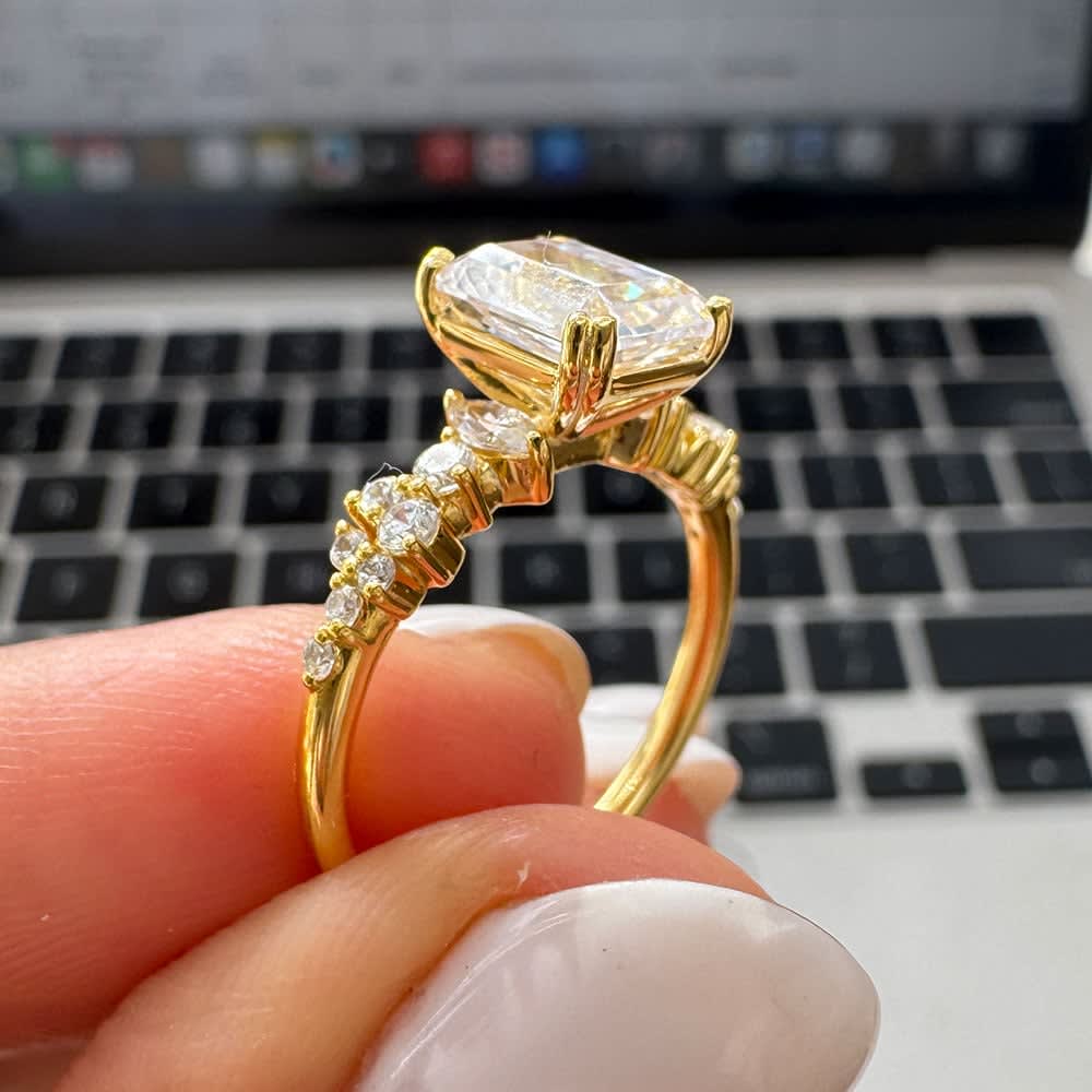 Emerald cut diamond engagement ring with double prongs