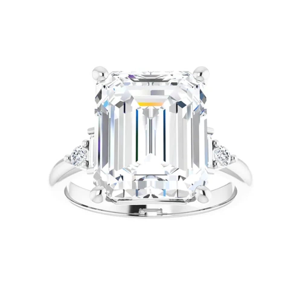 Emerald trilogy engagement ring