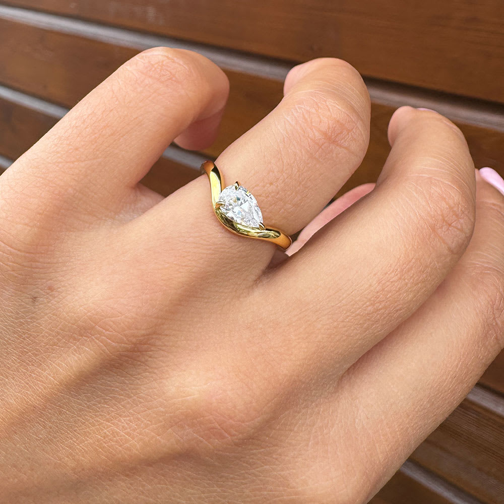 Lab grown diamond on a wave gold band