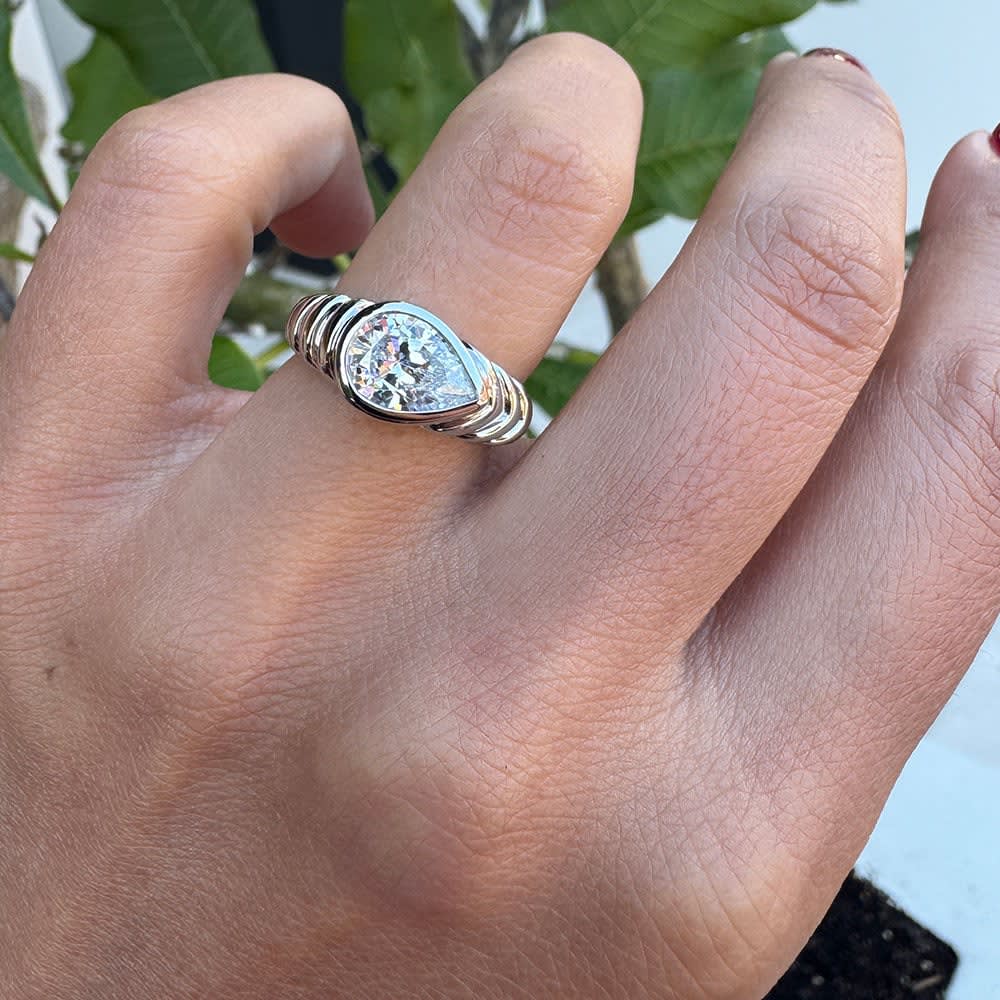 Lab pear cut bezel pattern gold band