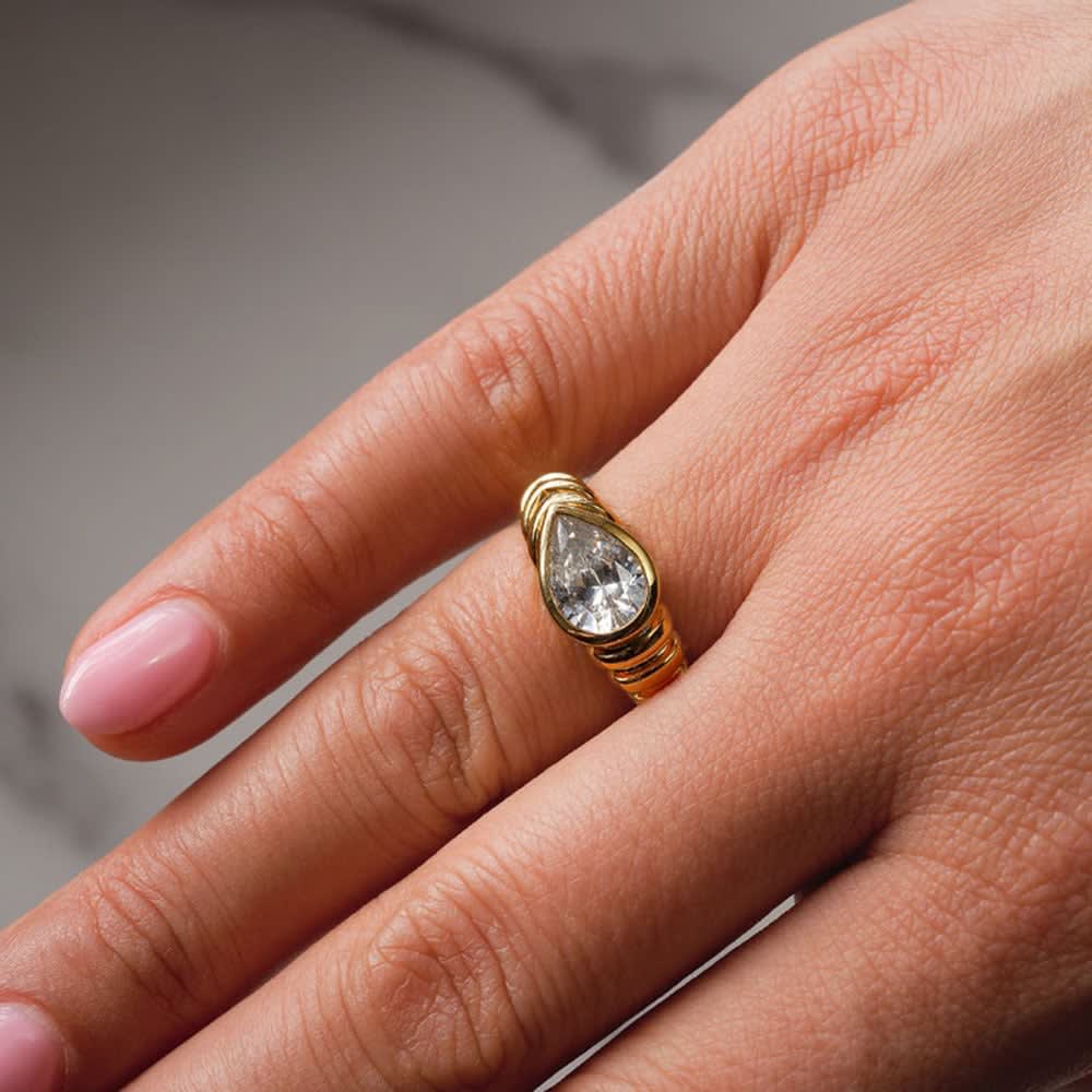 Lab pear cut bezel pattern gold band