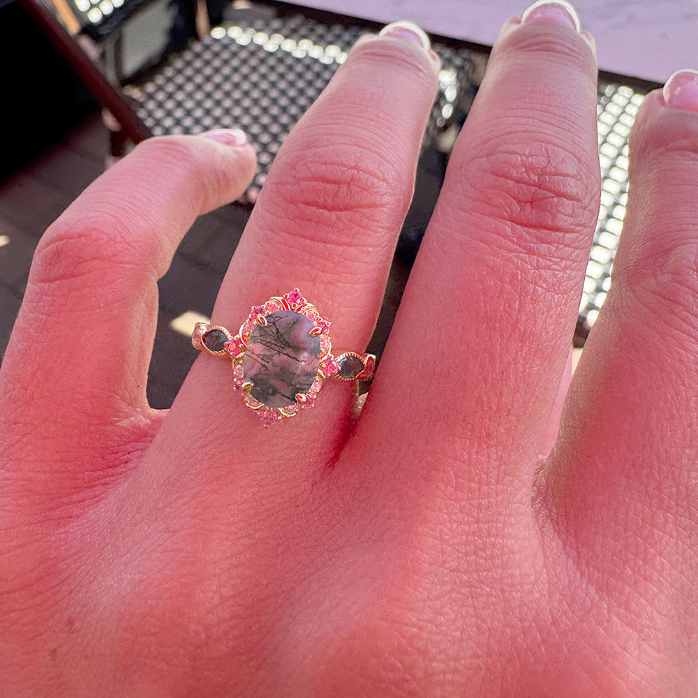 Moss agate ring in an art deco setting