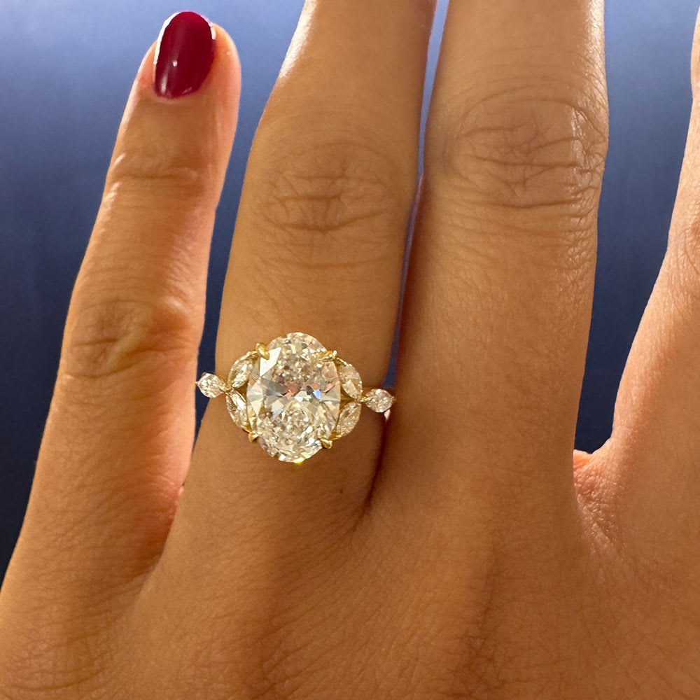 Oval lab with marquise side stone ring