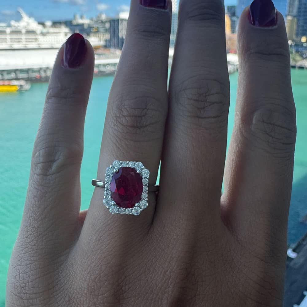 Lab grown oval ruby ring with diamond