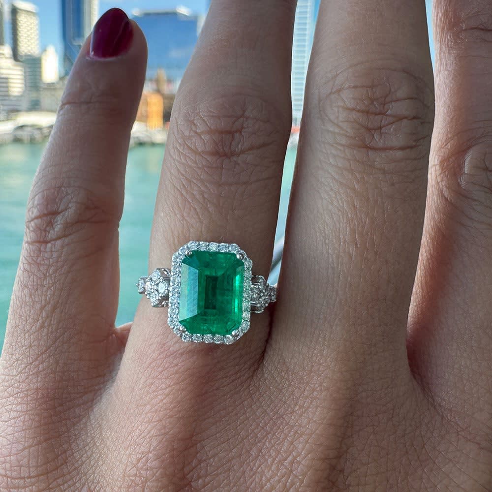 Lab grown green emerald and diamond ring