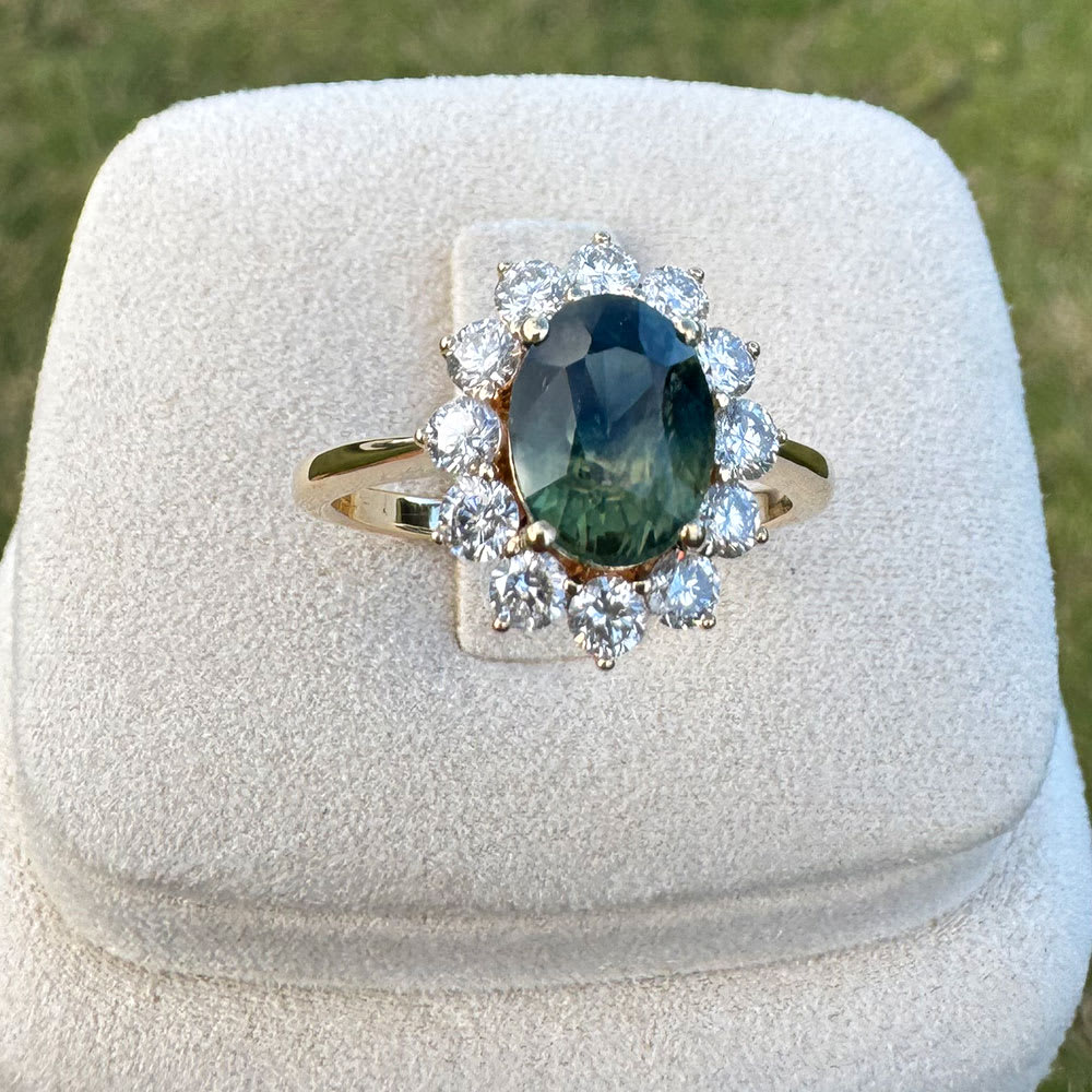 Oval Natural teal sapphire and diamond ring
