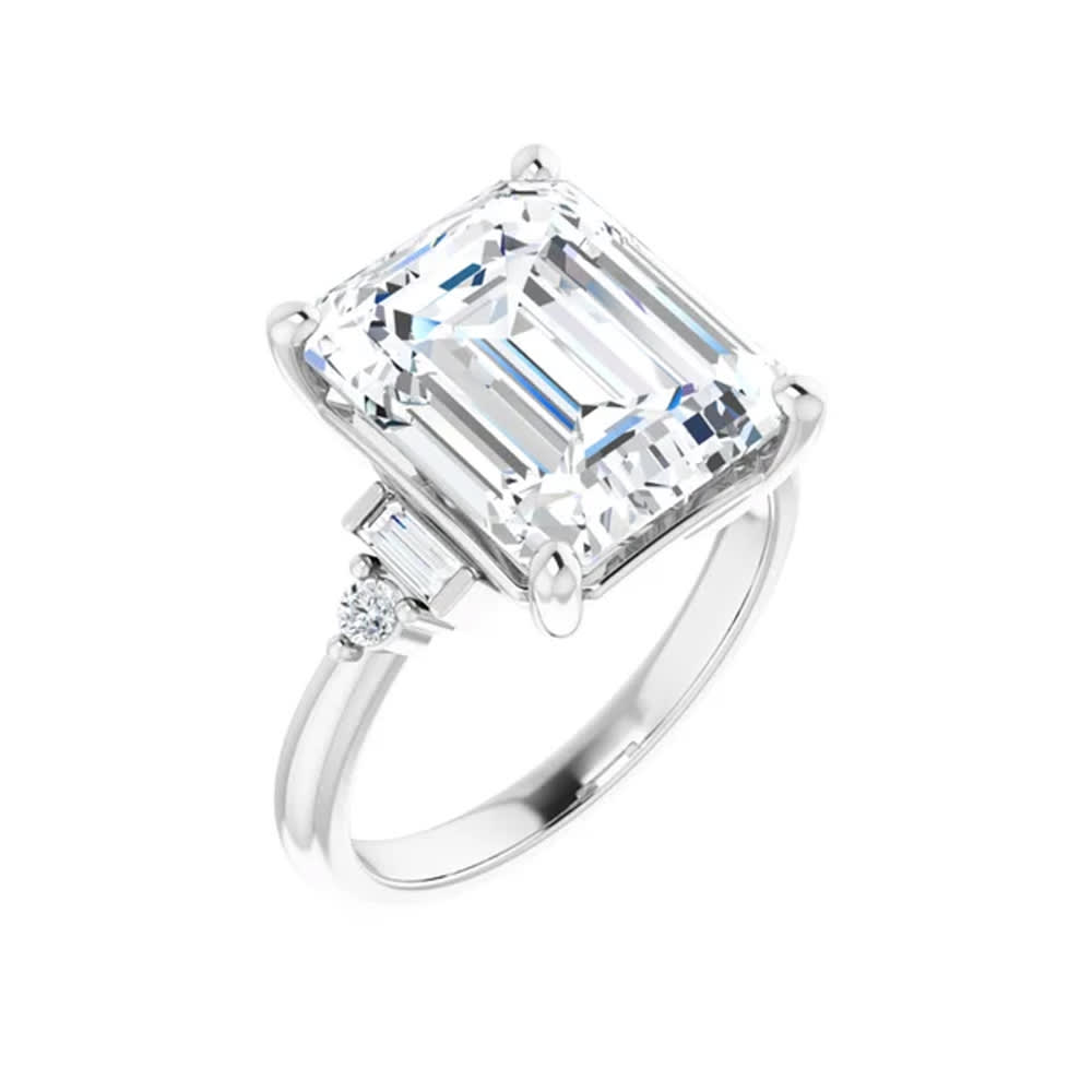 Emerald trilogy engagement ring