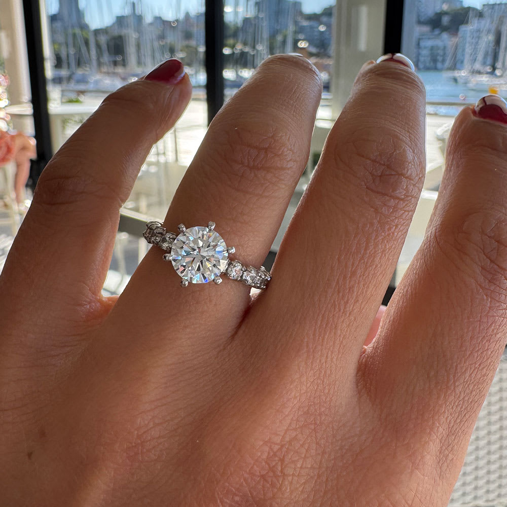 Lab round brilliant in six claw setting and diamond band