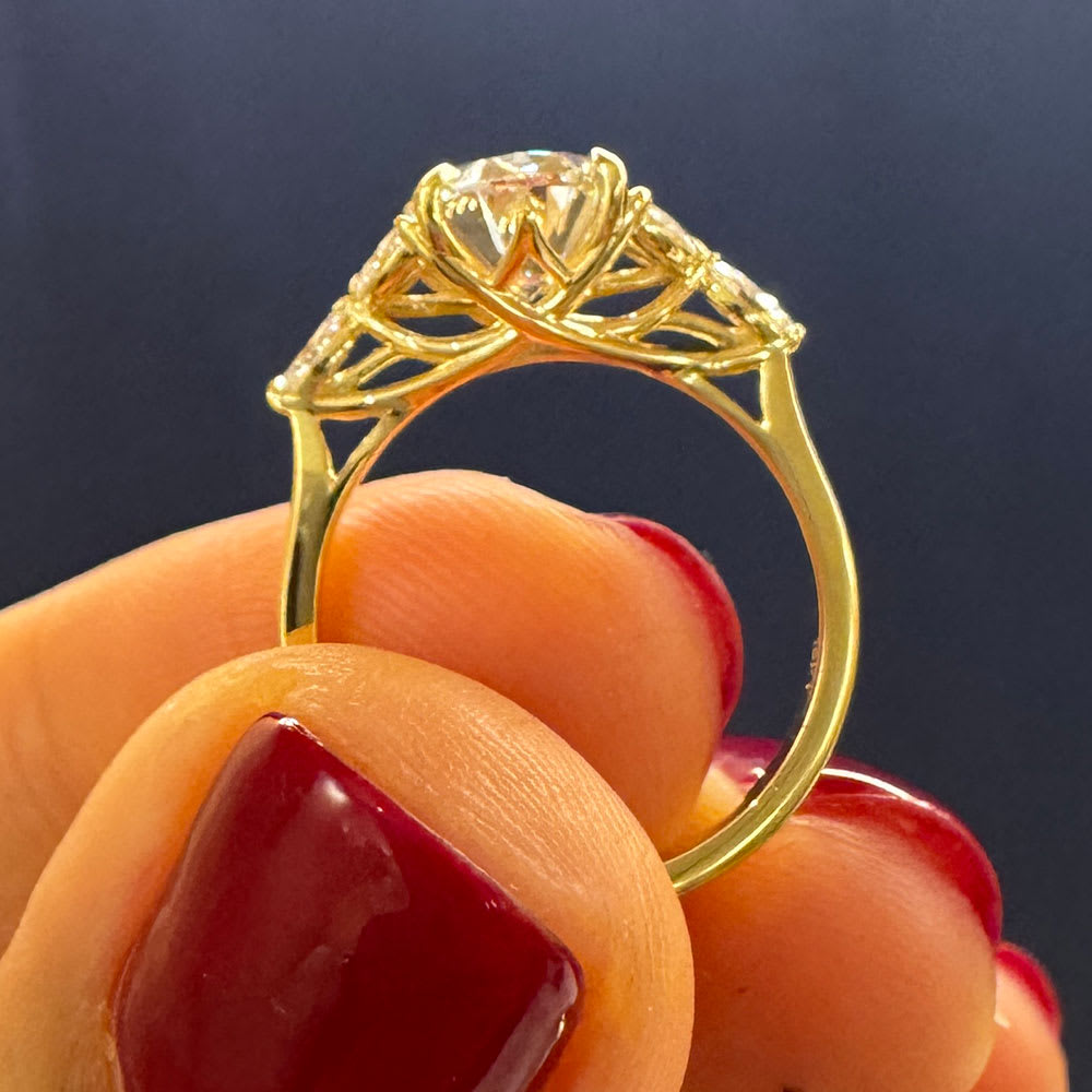 Oval lab with marquise side stone ring