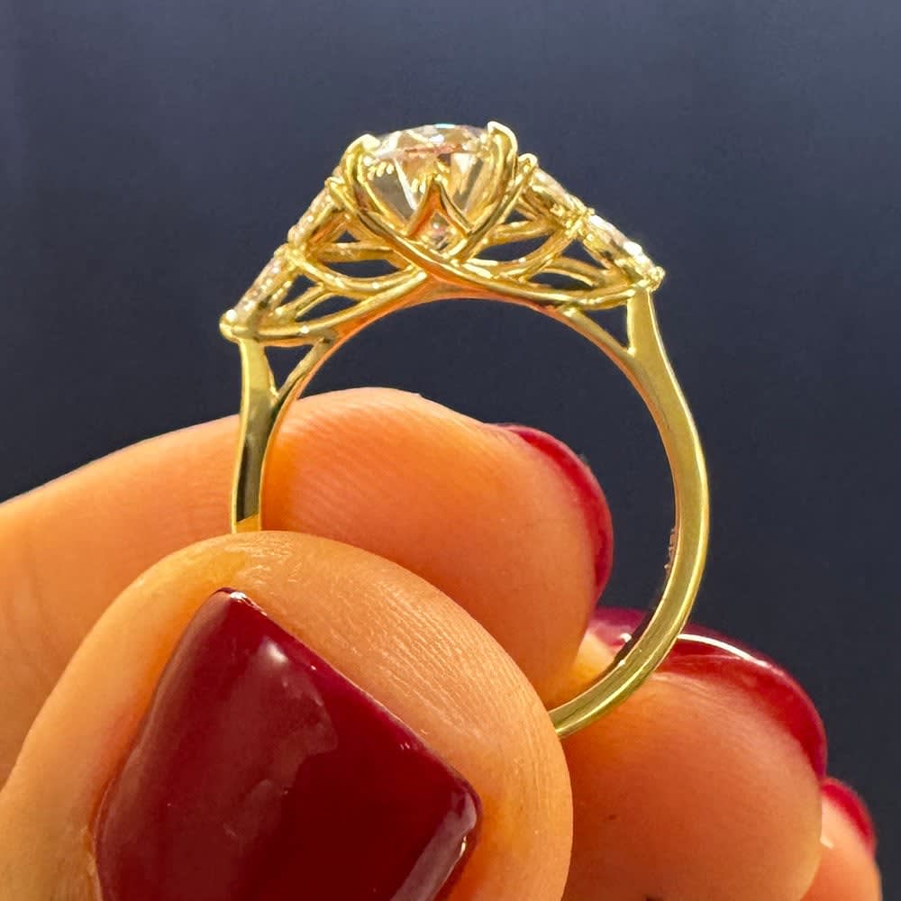 Oval lab with marquise side stone ring