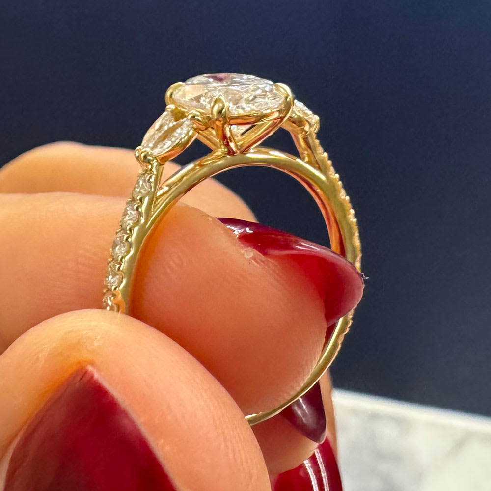 Oval lab with marquise engagement ring