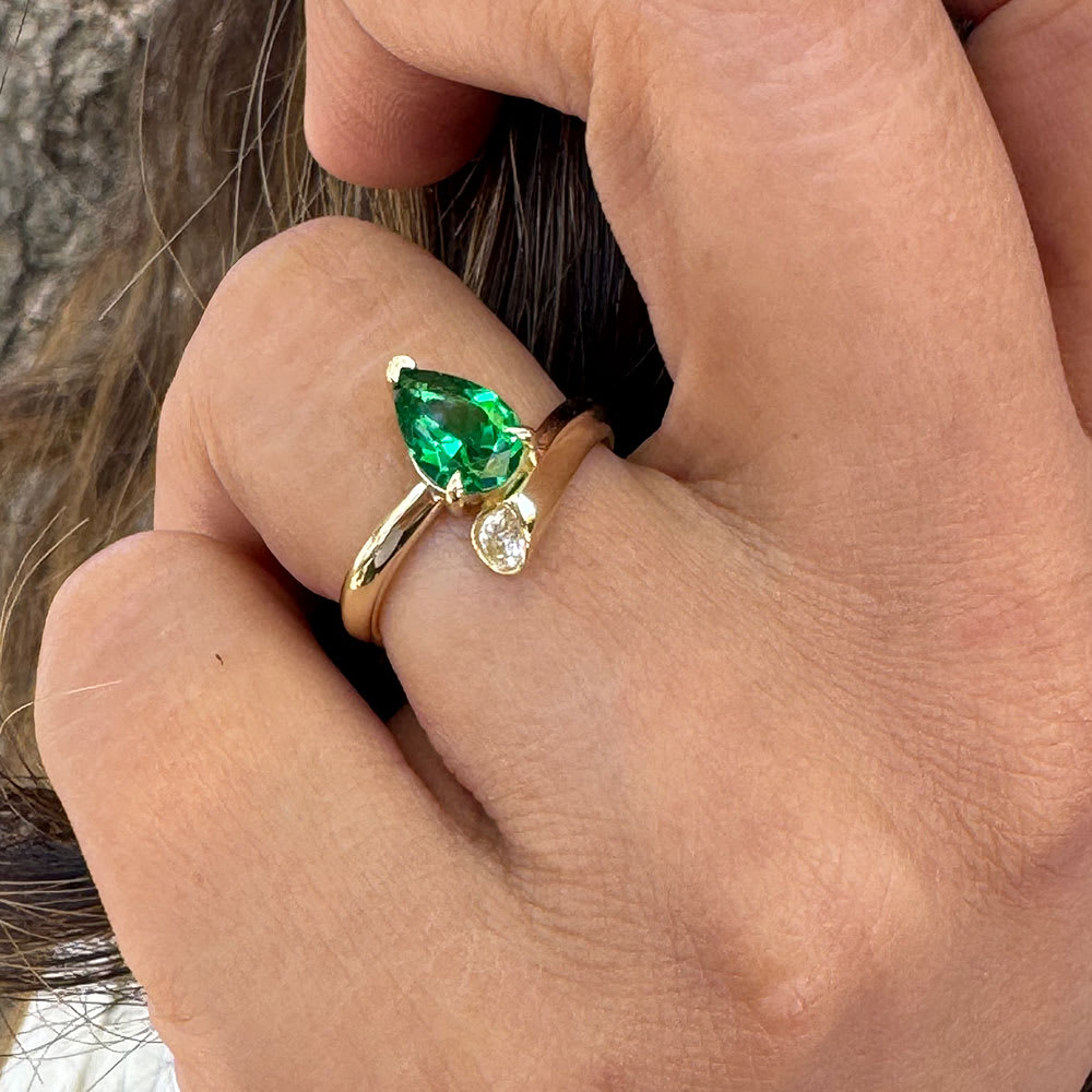 Green emerald in a unique setting