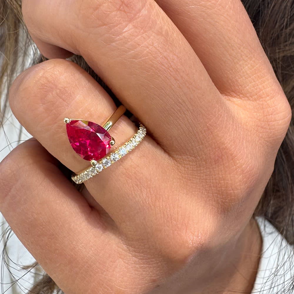 Lab Ruby set in a wave diamond band