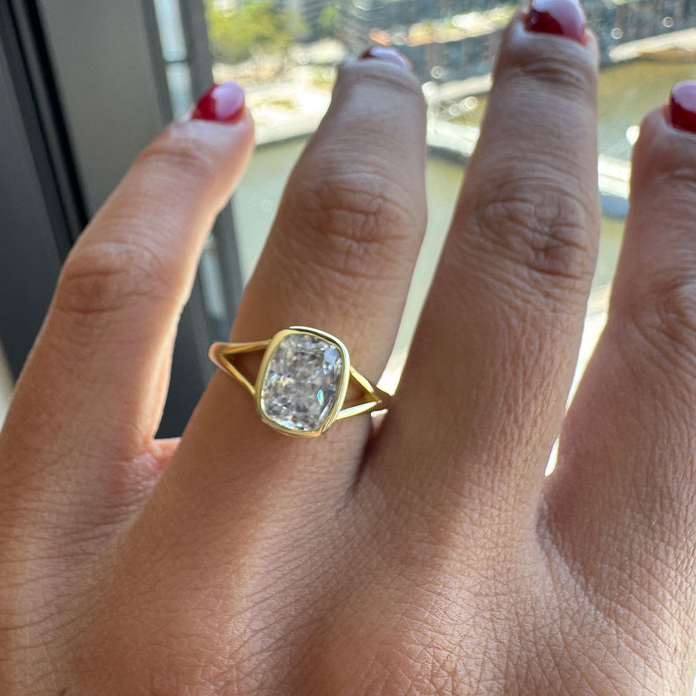 Bezel set cushion cut diamond