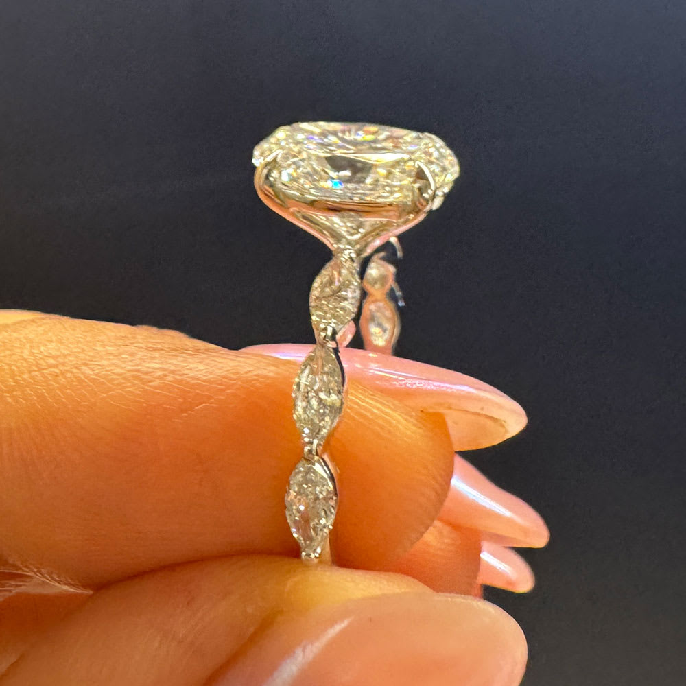 Oval diamond on a marquise cut band