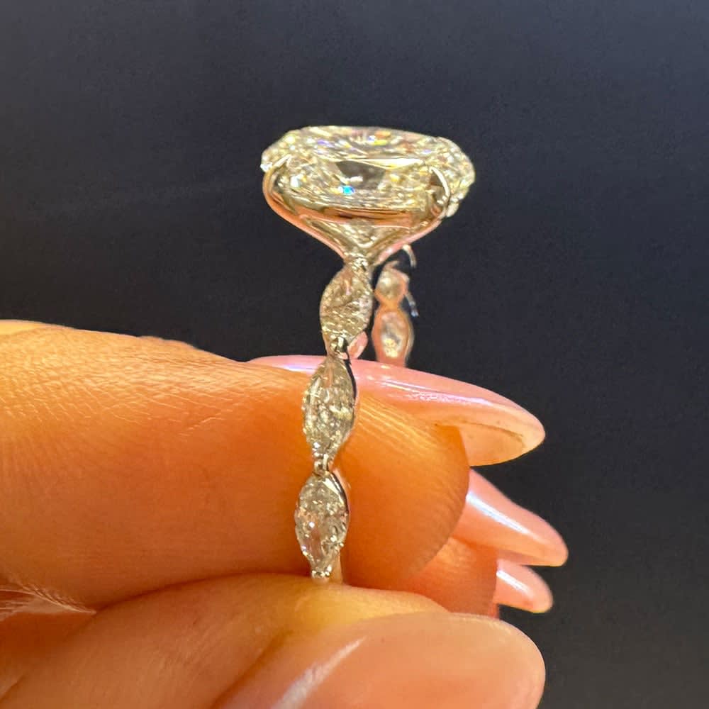 Oval diamond on a marquise cut band
