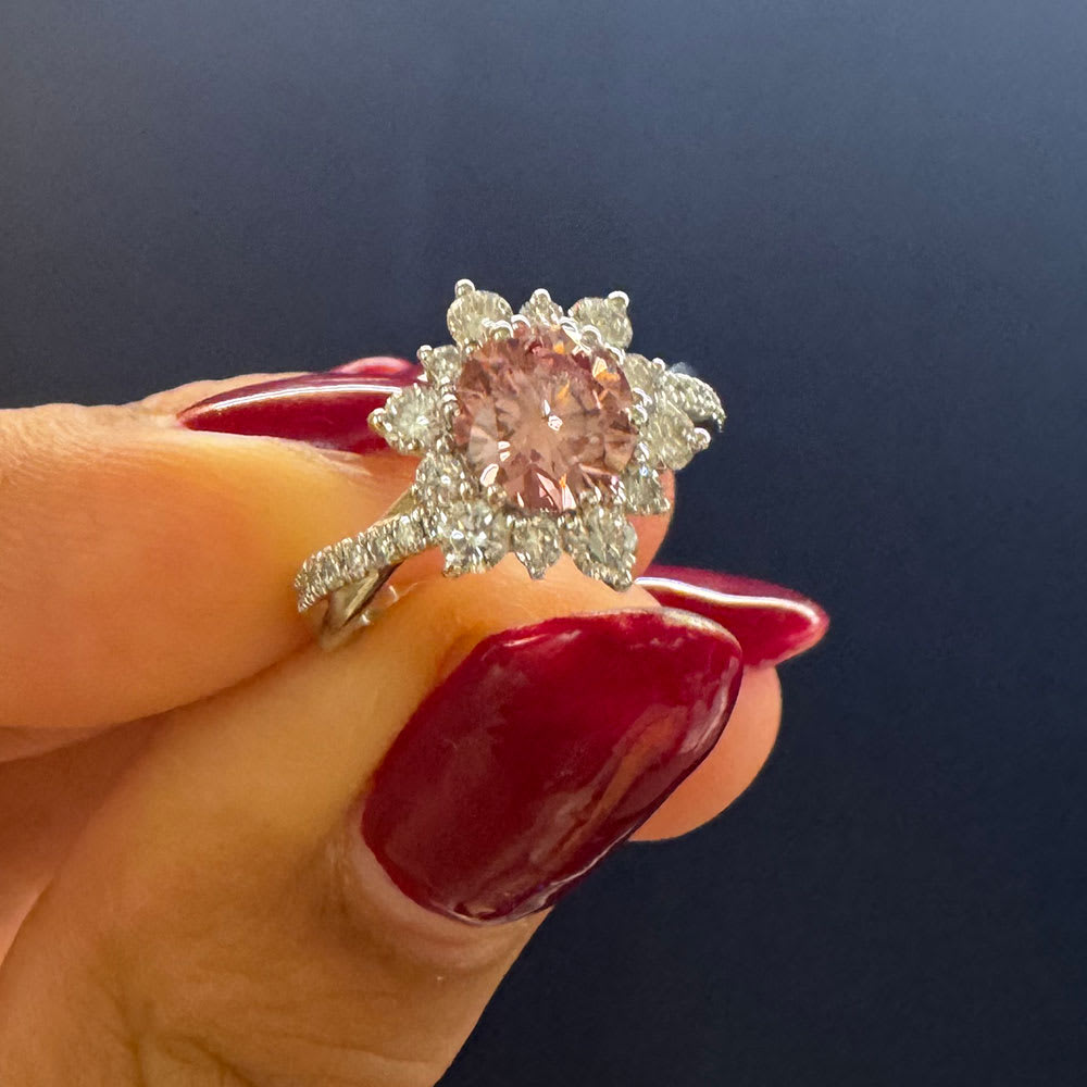 Pink diamond on a floral setting