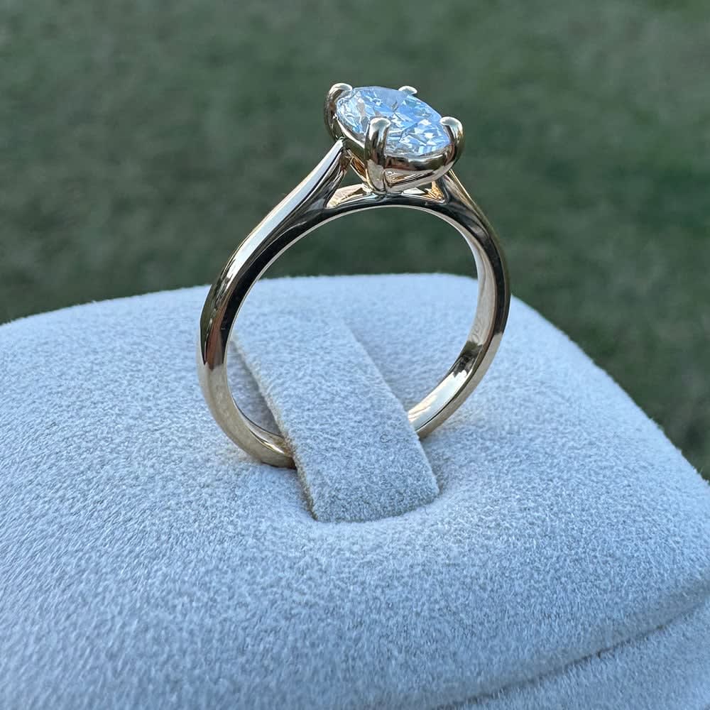 1ct oval solitaire on a gold band