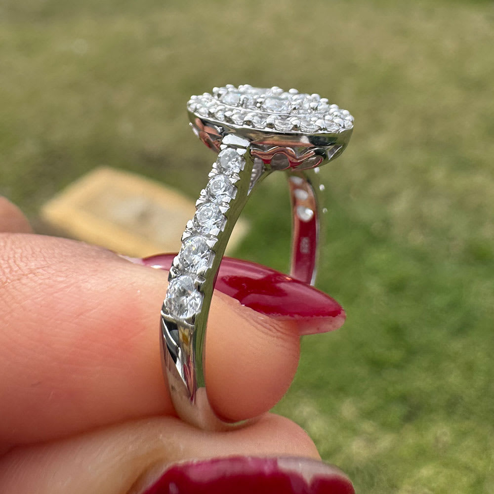 Oval cluster with halo and diamond band