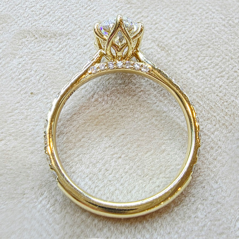 oval diamond set with tiger prongs and tulip setting