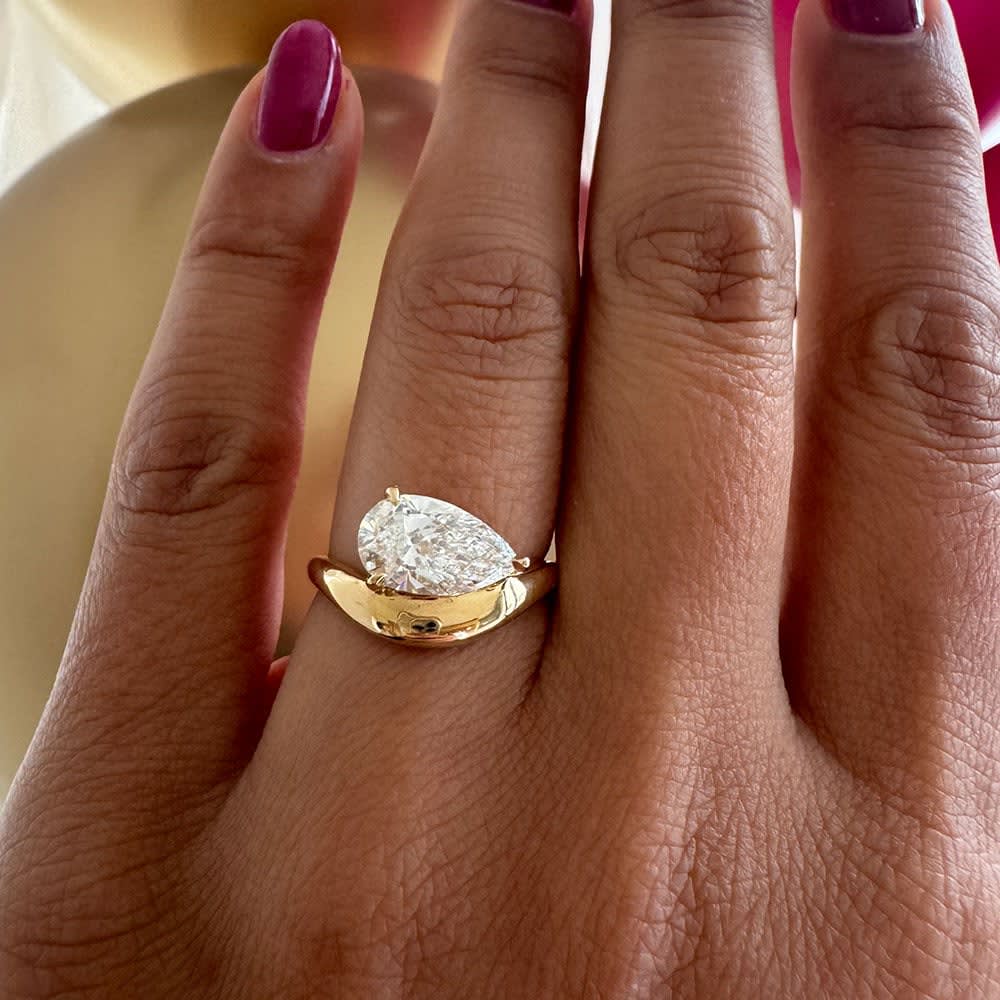Pear diamond on a thick gold band