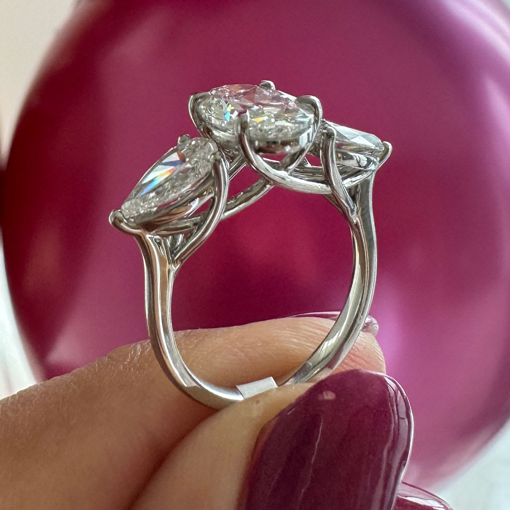 Oval with pear trilogy ring