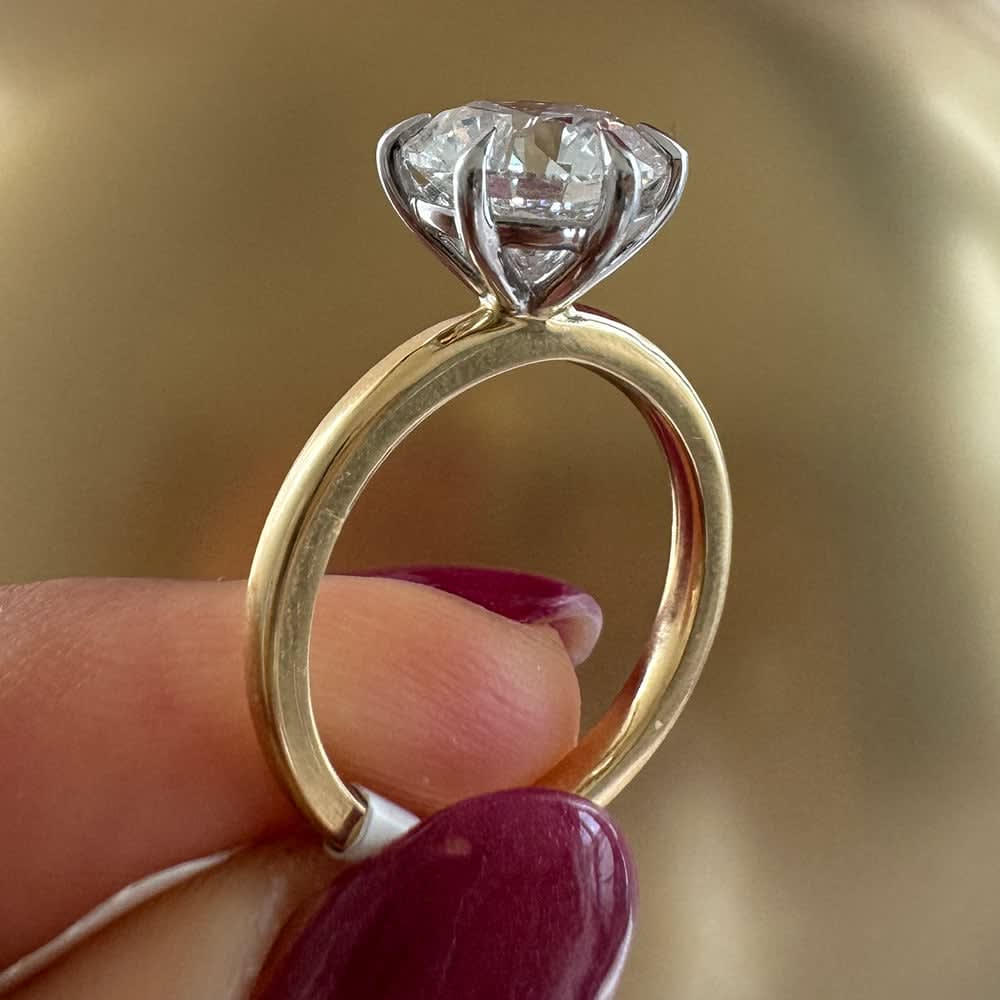 3 carat round brilliant diamond on two tone setting