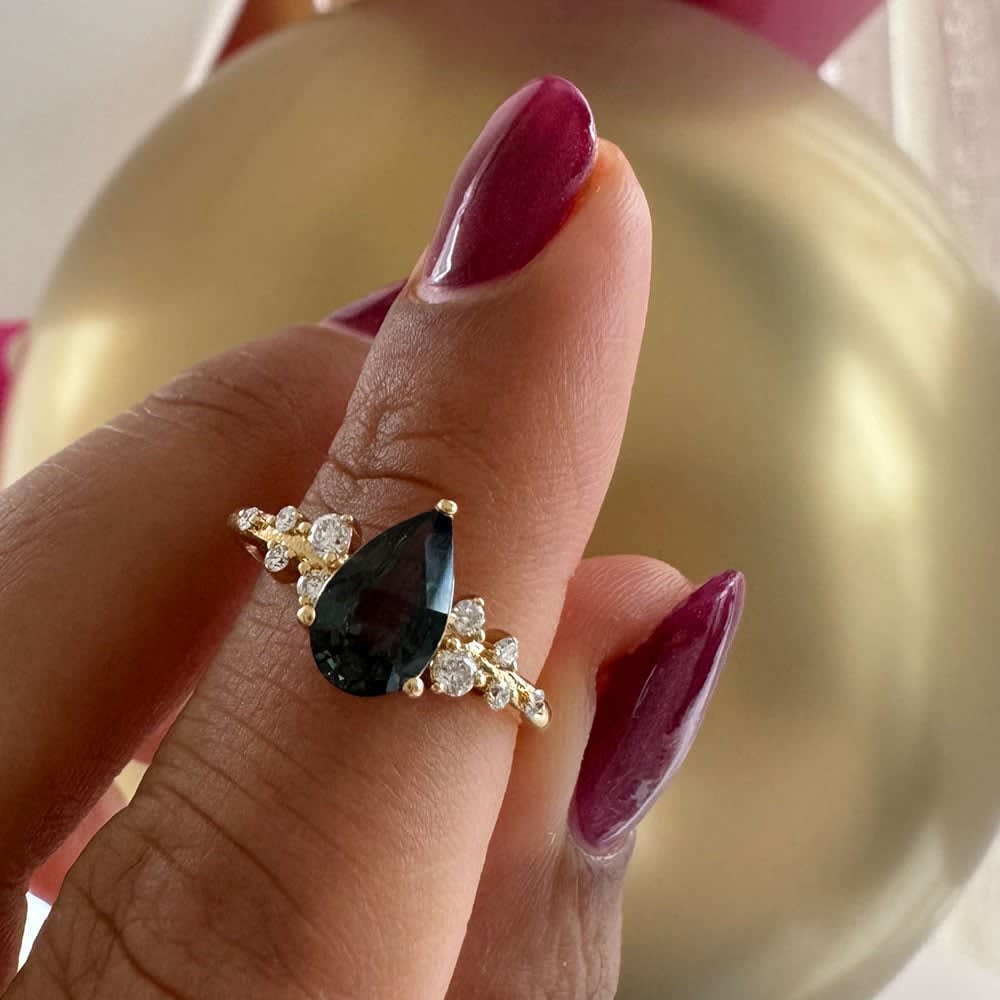 Pear cut natural green sapphire ring