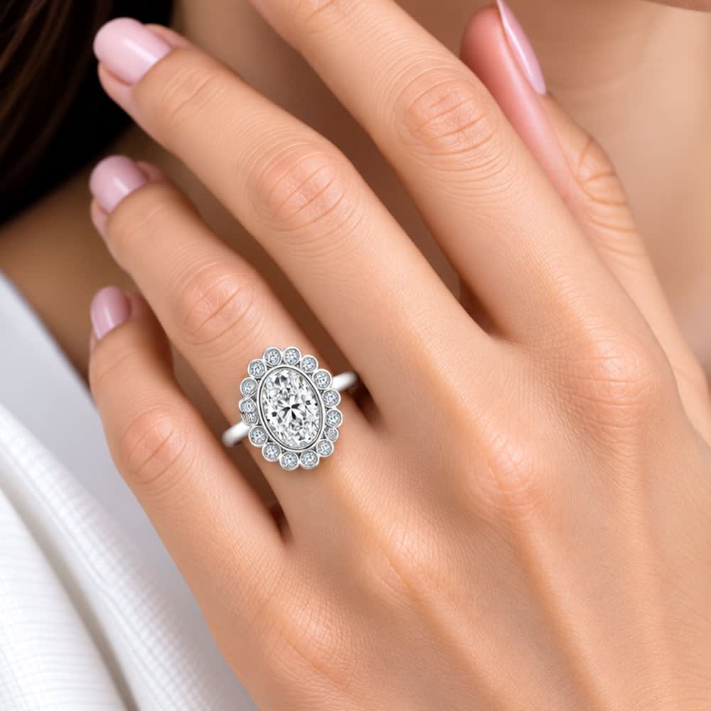 oval diamond with bezel set halo