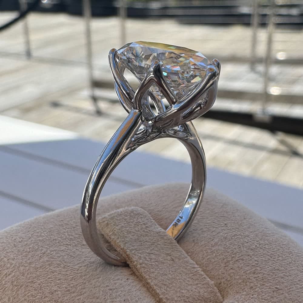 6 carat oval set in tulip setting