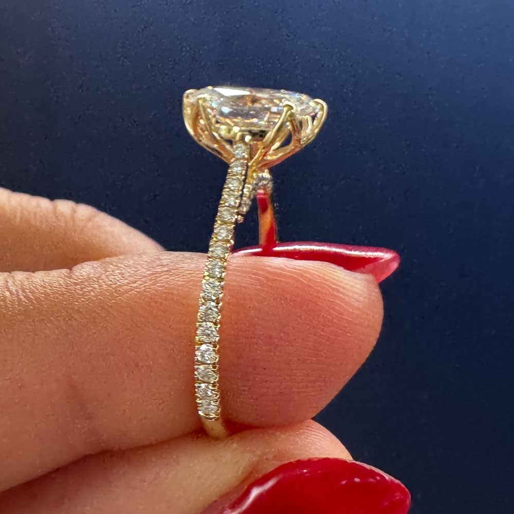 Oval cut diamond in tulip setting