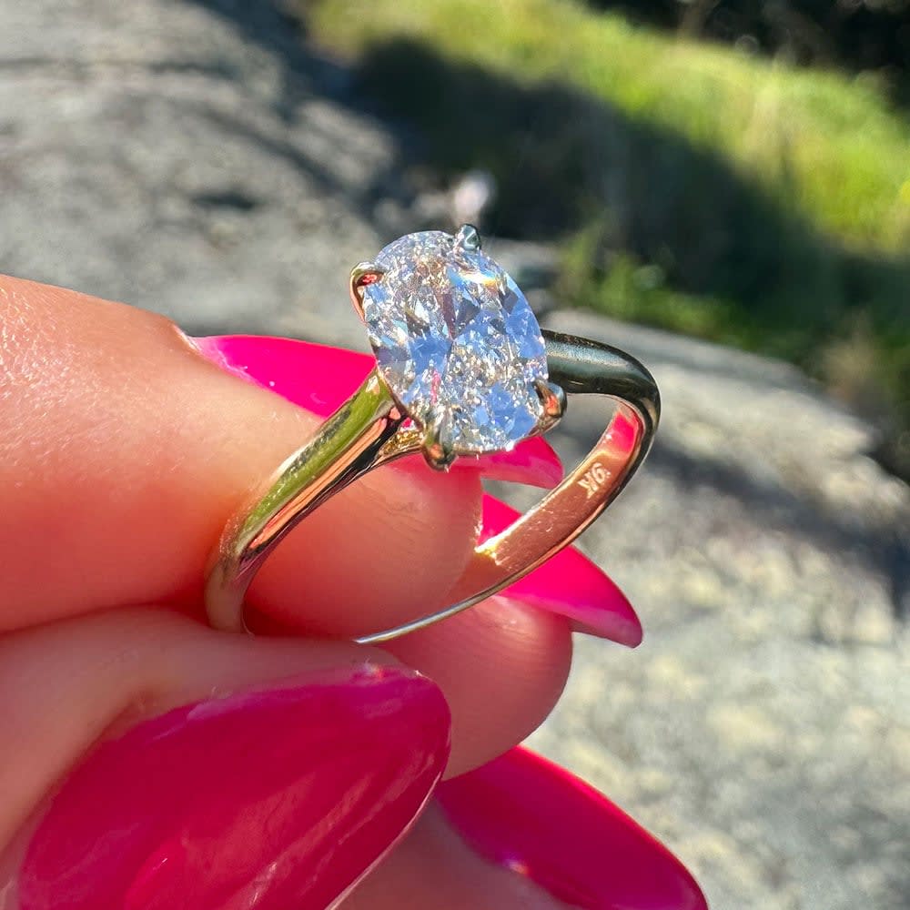 1 carat oval diamond on a gold band