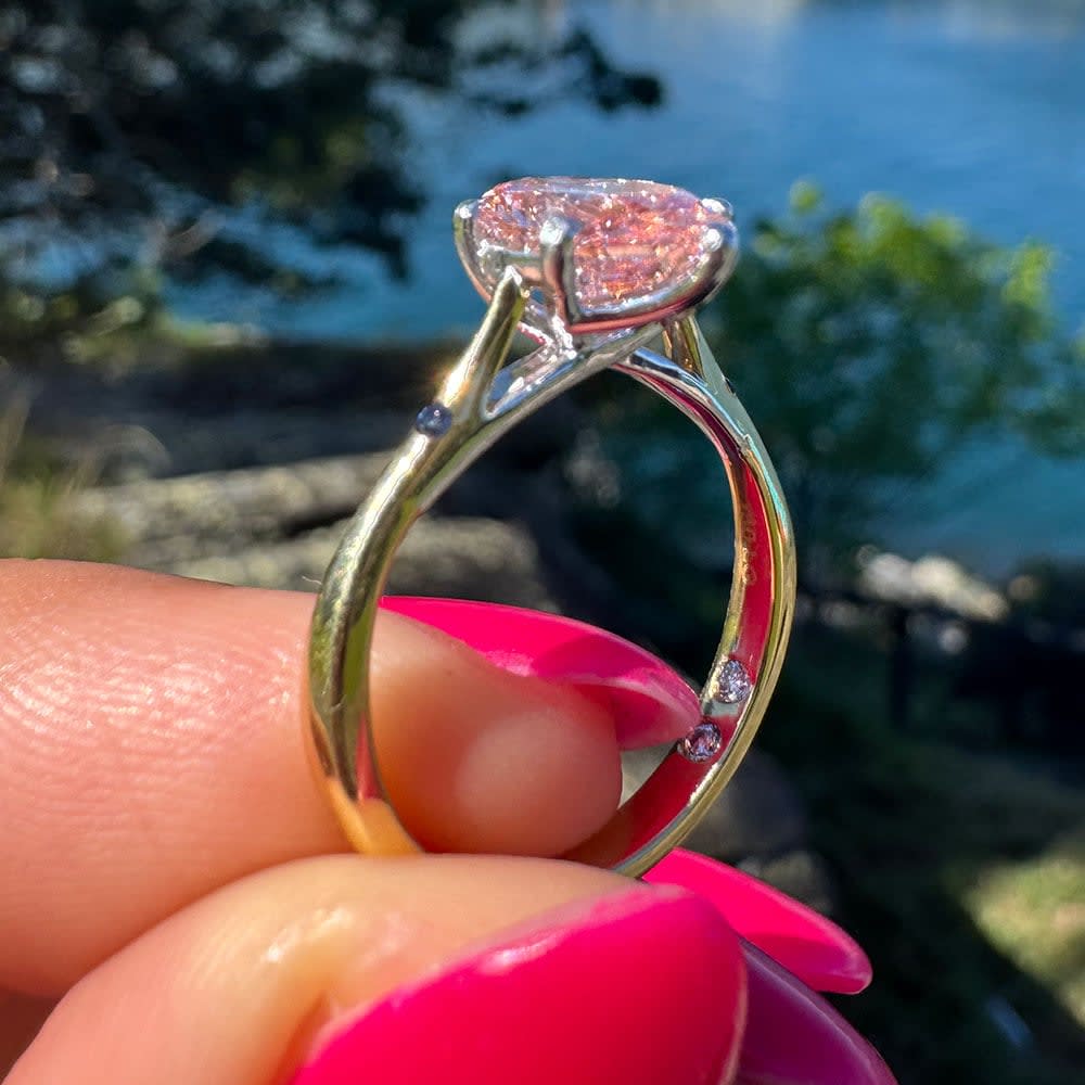 Fancy vivid pink oval diamond engament ring