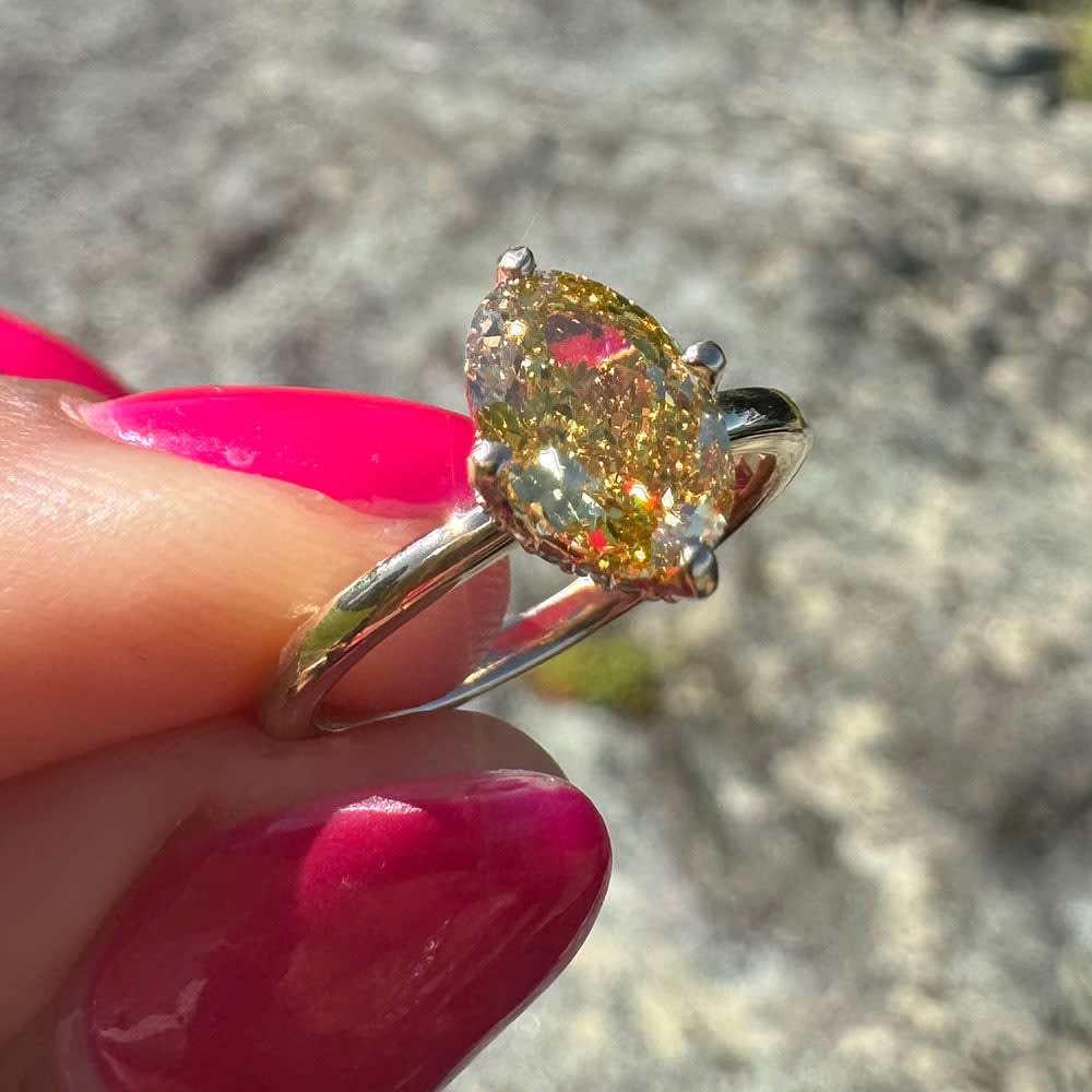 Fancy vivid yellow diamond ring