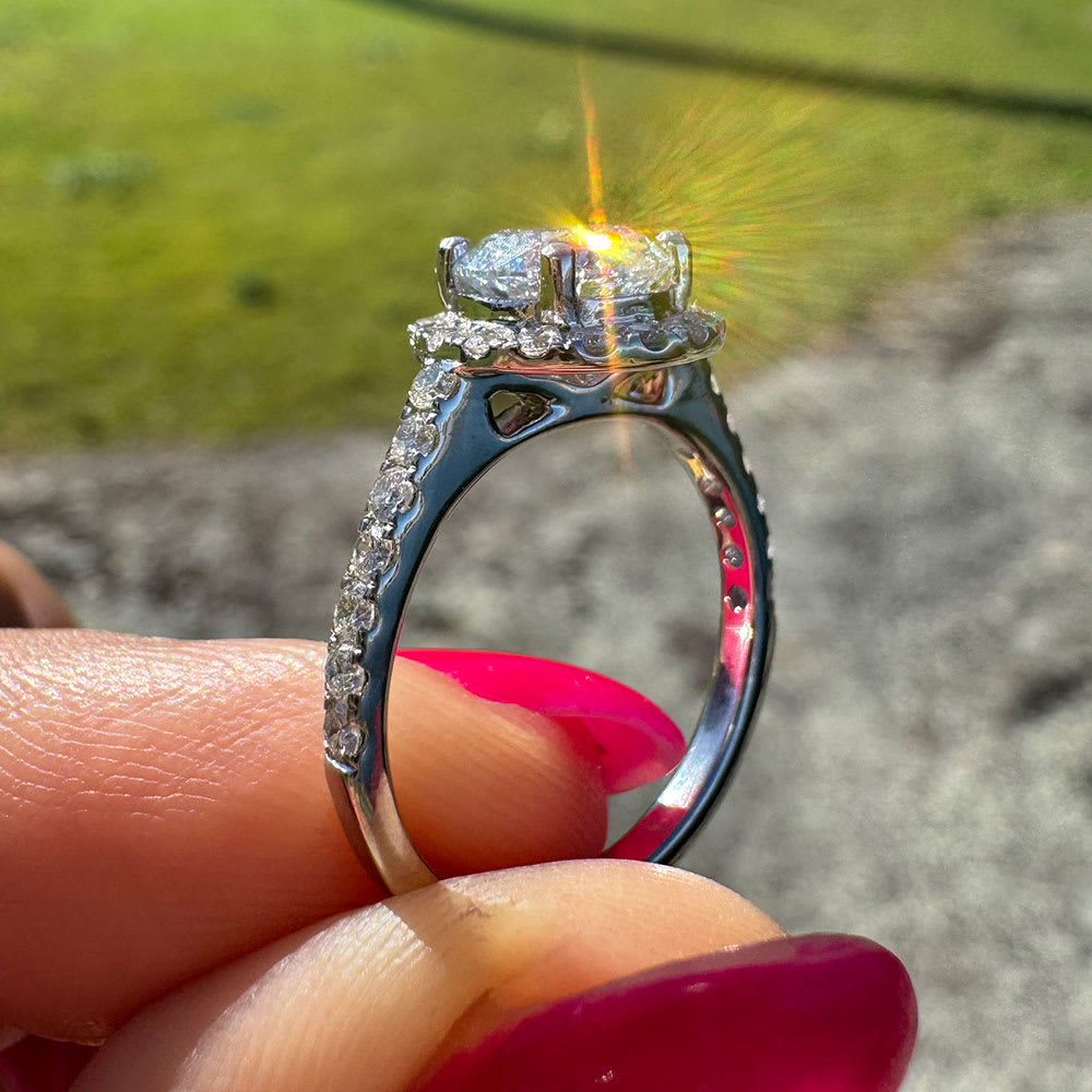Round diamond with a halo classic engagement ring
