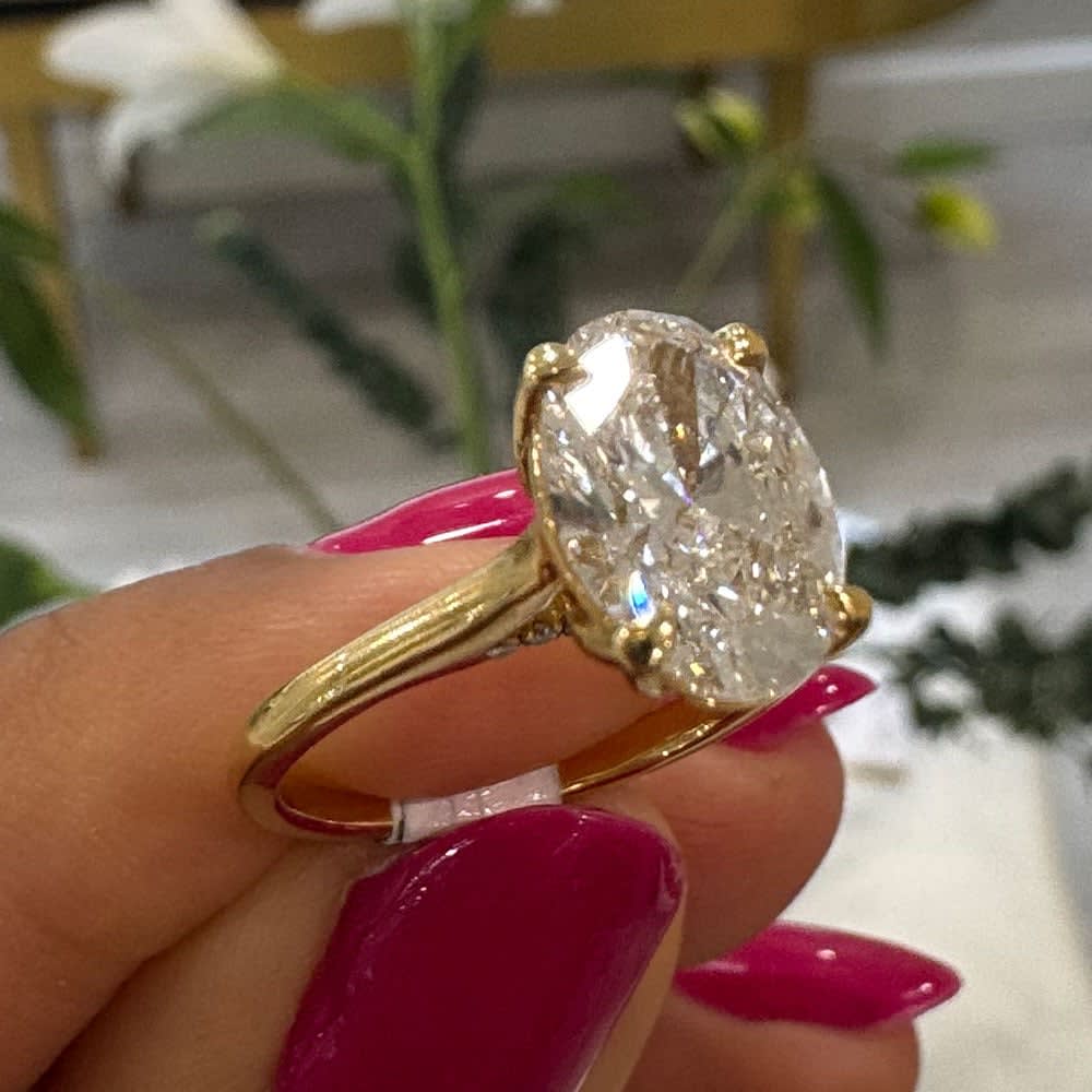 Oval diamond with a tulip setting