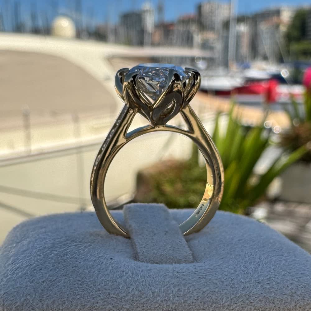 4ct moval in a tulip setting and vintage band