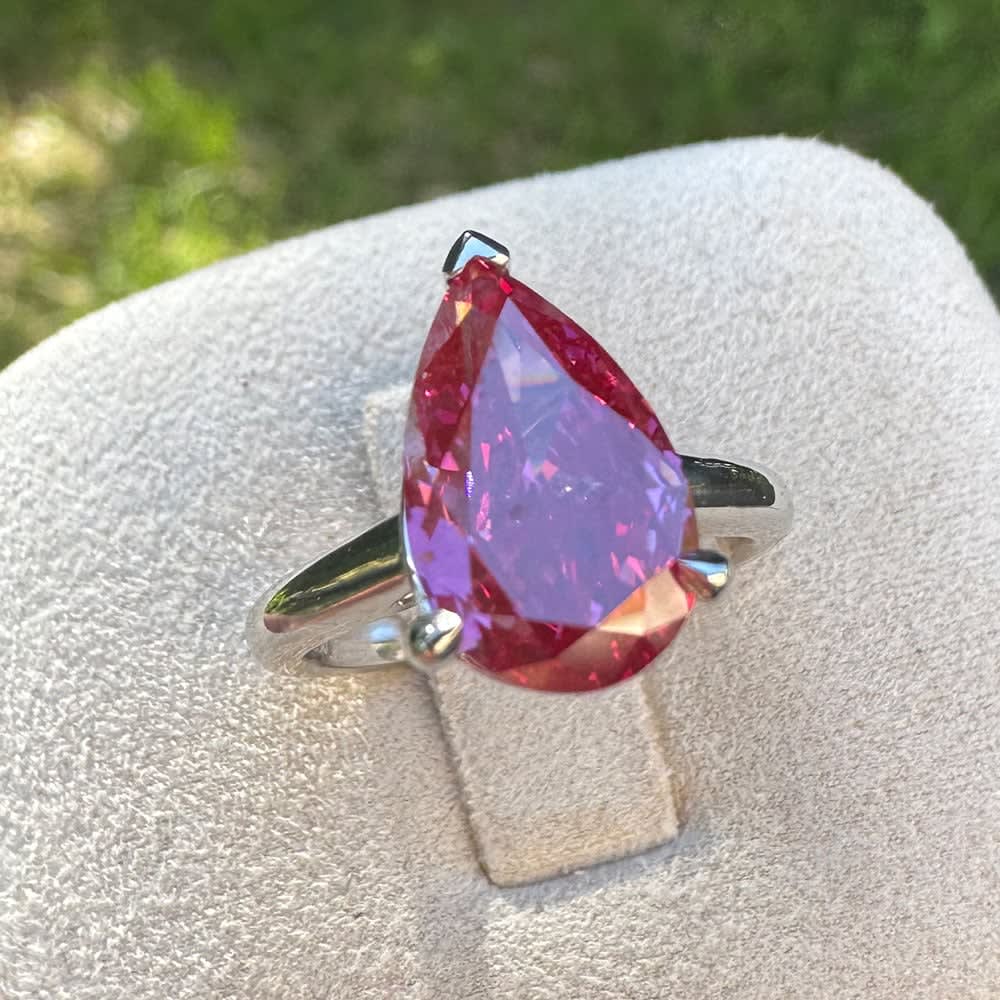 Fancy vivid pink pear diamond ring