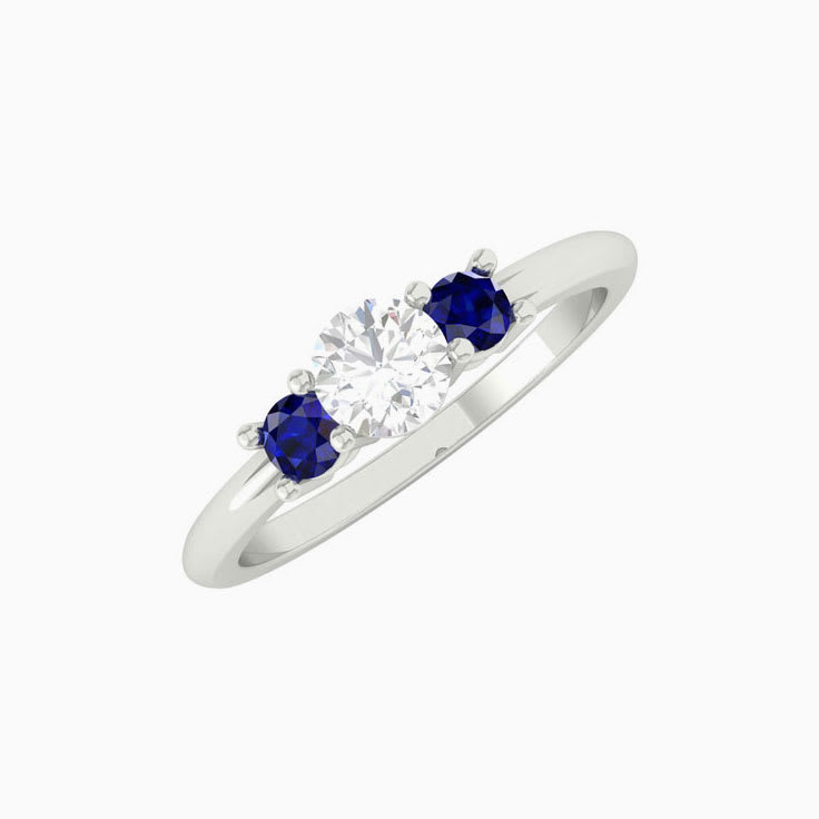 White diamond with blue sapphire trilogy