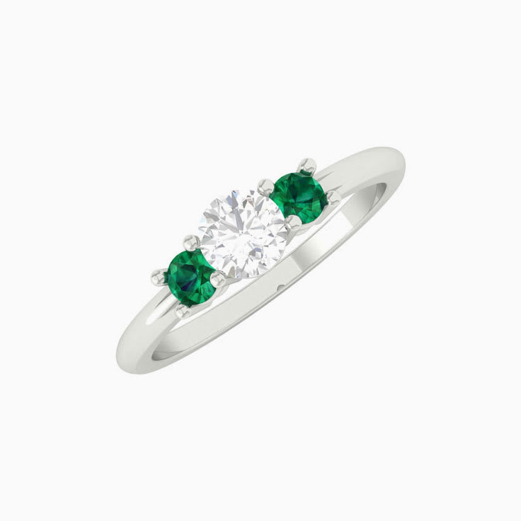 White diamond with green emerald trilogy