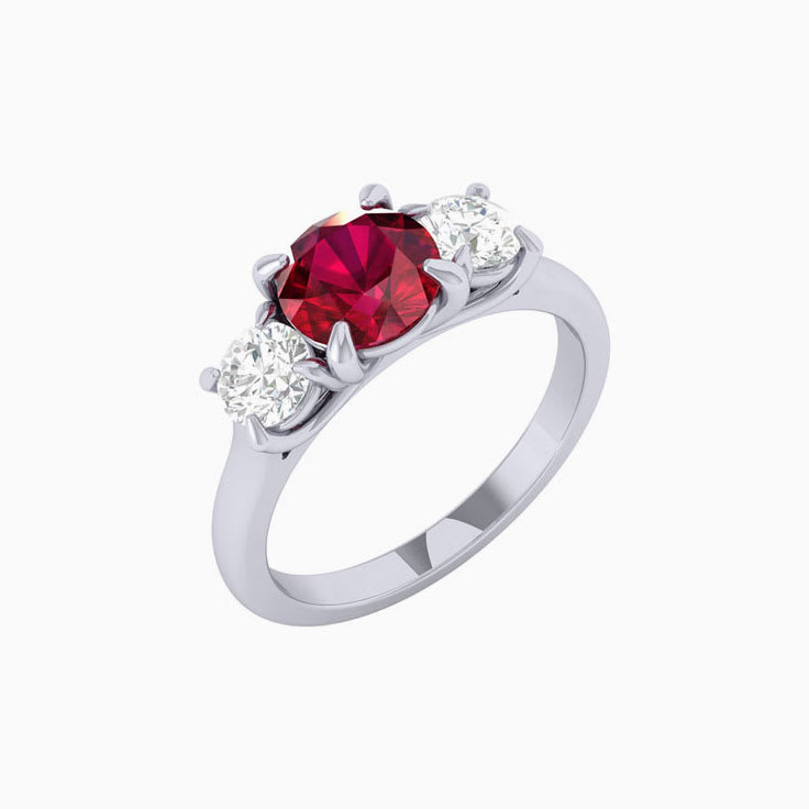 Round ruby with diamond trilogy ring