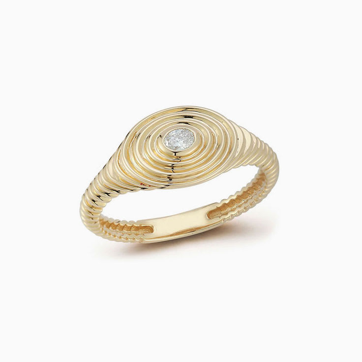 Unique oval signet ring with diamond