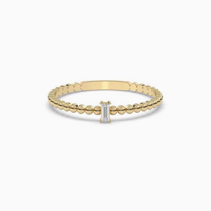 Petite baguette cut diamond ring