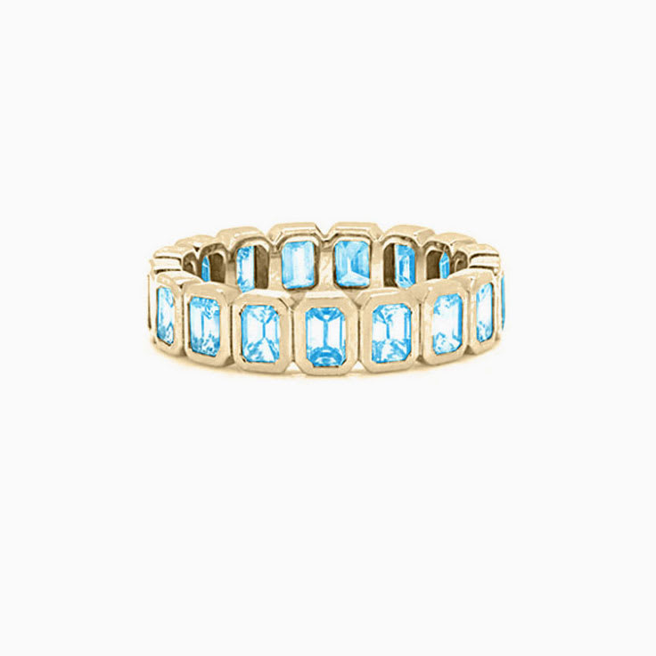 Sky Blue Topaz Bezel Emerald eternity ring