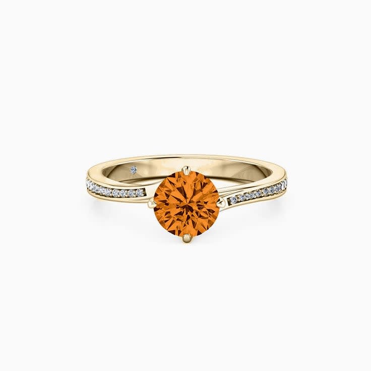 Round Brilliant cut Orange Sapphire on a twisted diamond band