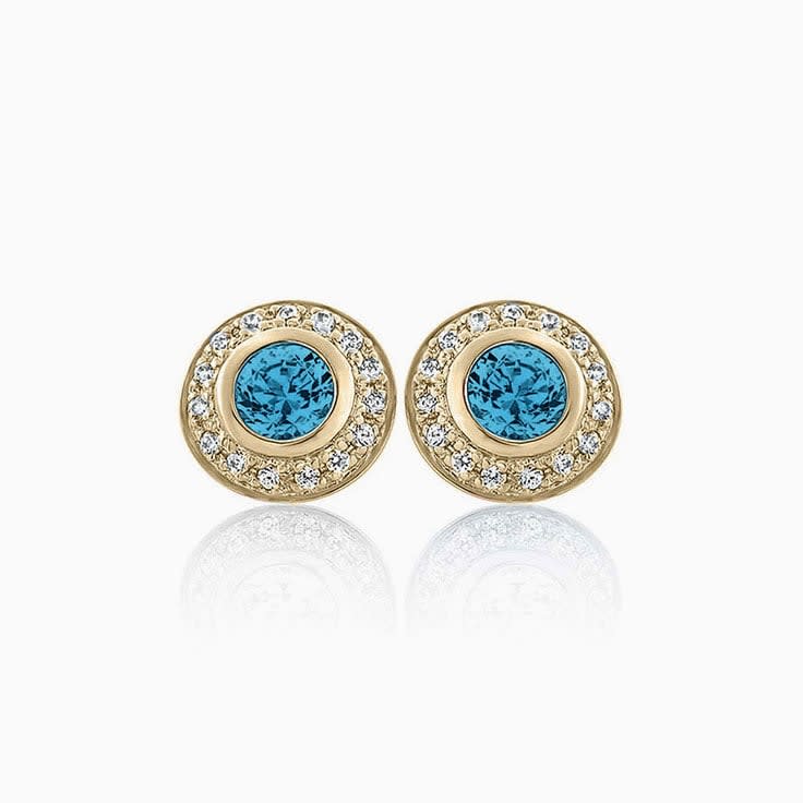 Enhanced Blue Diamond Bezel set with halo studs