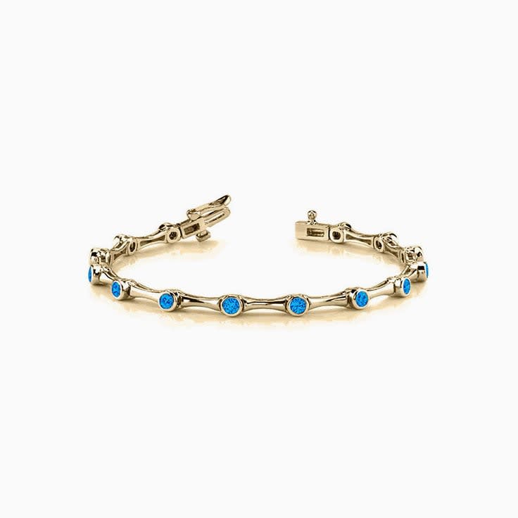 swiss blue topaz Round Bezel Set Branched Tennis Bracelet