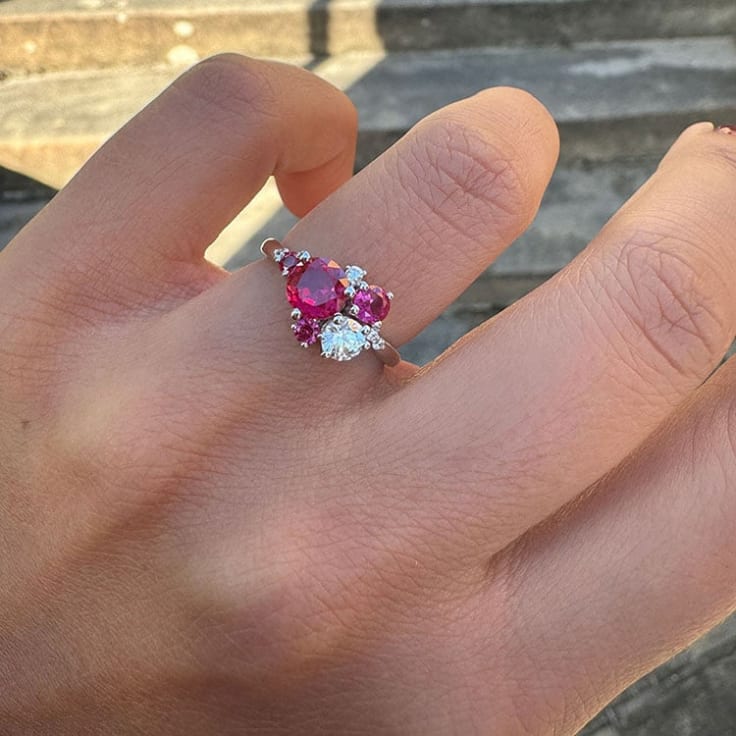 Round rubies and diamond ring