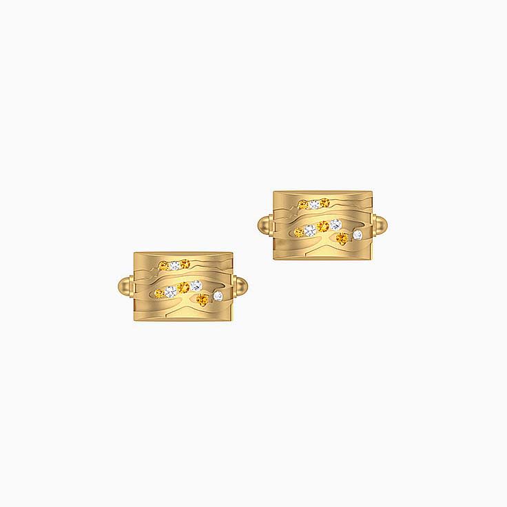 Cufflinks with white and champagne diamonds.