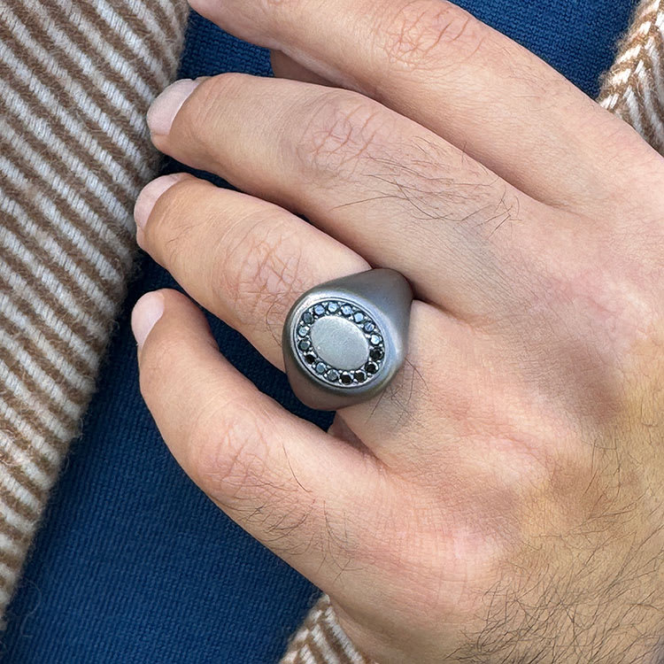 Oval dark metal signet ring